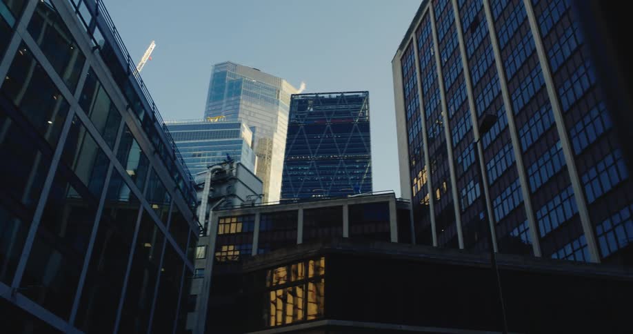 Several tall and mirrored buildings in a set of a city