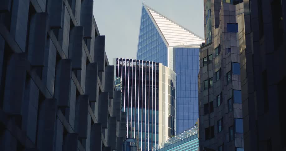 View of towering buildings with glass facades