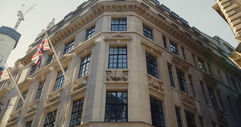Building with british flags sits close to intersection
