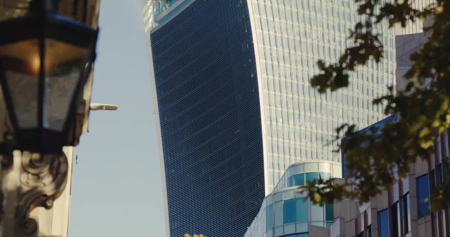 The sun shines on downtown buildings with unique architecture
