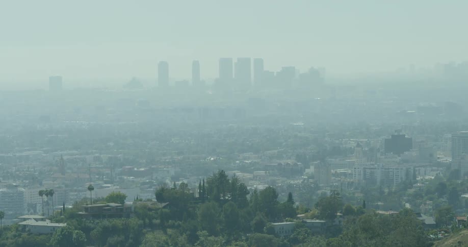 The city in the distance has heavy fog covering it