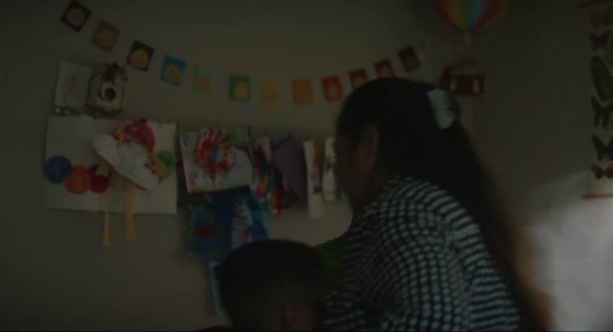 One brother helps his mother separate his two brothers who were fighting