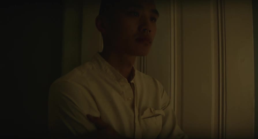 Man turning on the light and massaging his arm
