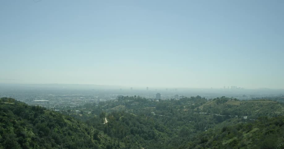 The range below is covered with hills and bushes