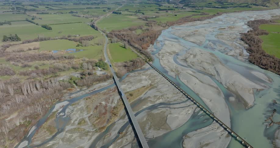 Vehicles cross the river on a bridge