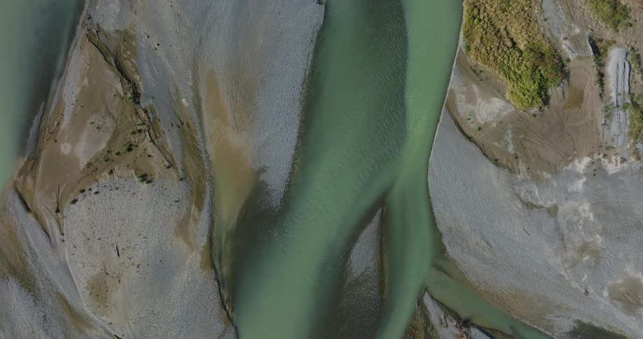 An aerial view of a huge river passing through mountains