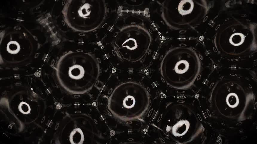 Fluid flows under and between light reflecting hexagonal sections