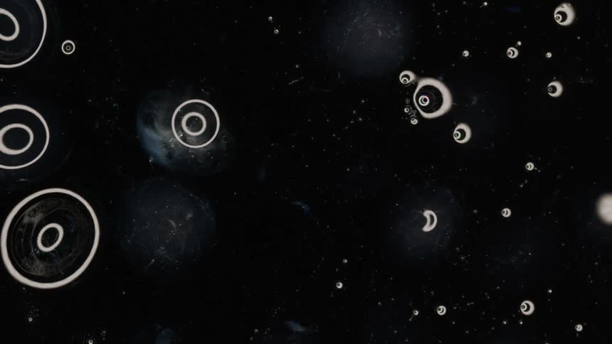Abstract liquid texture with bubbles and a background of ecosystem and abstract stars