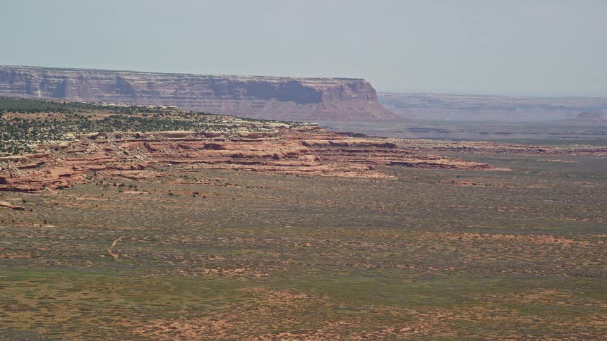  aerial footage showcases the breathtaking Douglas Mesa in the Navajo Nation Reservation offering a wide view of the arid desert landscape table mountains and native American tribal lands