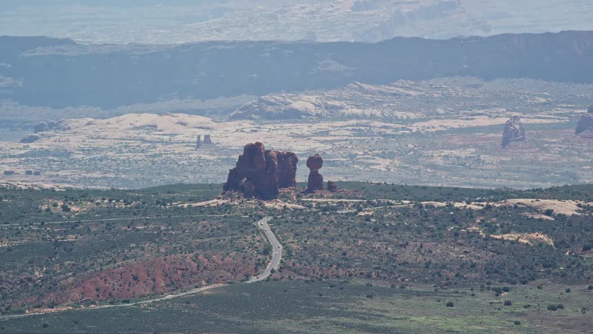 Aerial view of Balanced Rock and Scenic Drive in Arches National Park Utah showcasing the desert landscape and transportation