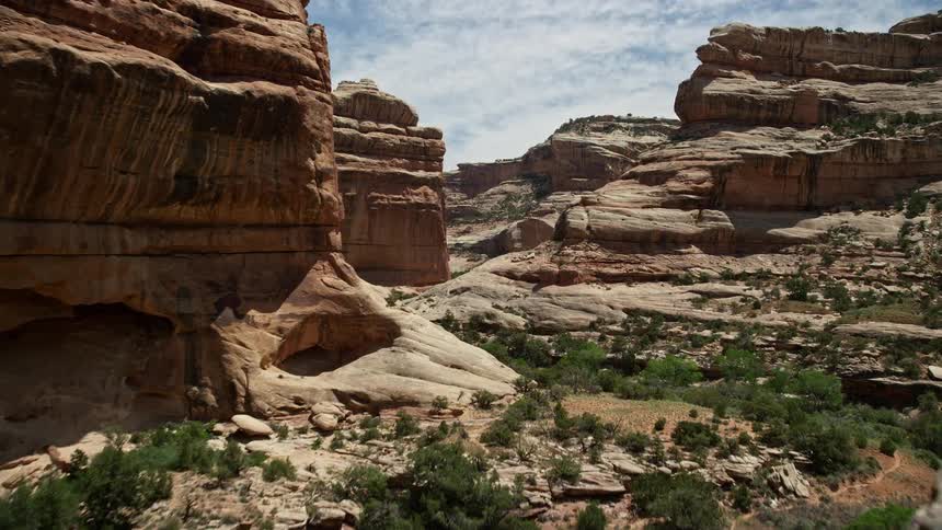 Aerial footage of flying through the stunning Grand Gulch in the arid canyons of Utah with breathtaking views of the Southwest United States