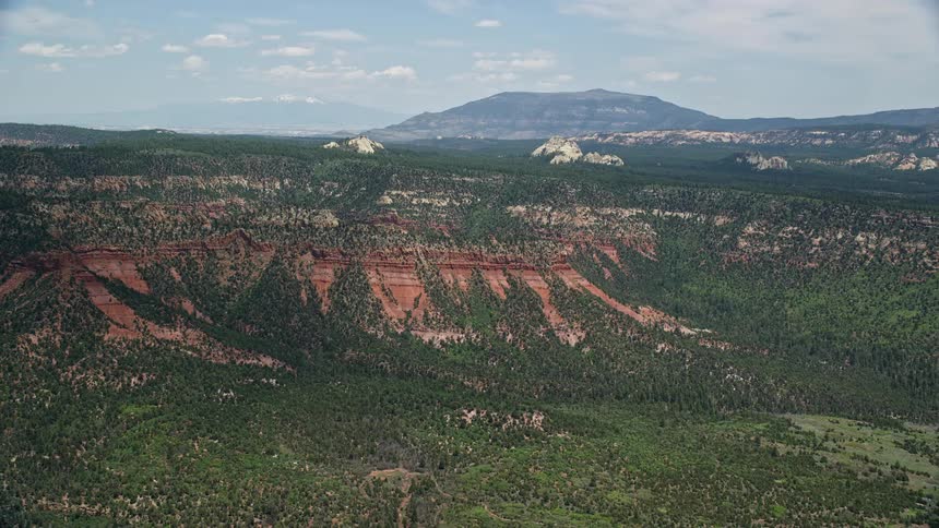 an aerial view of rock formations on a mesa in Manti-La Sal National Forest Utah during a sunny day