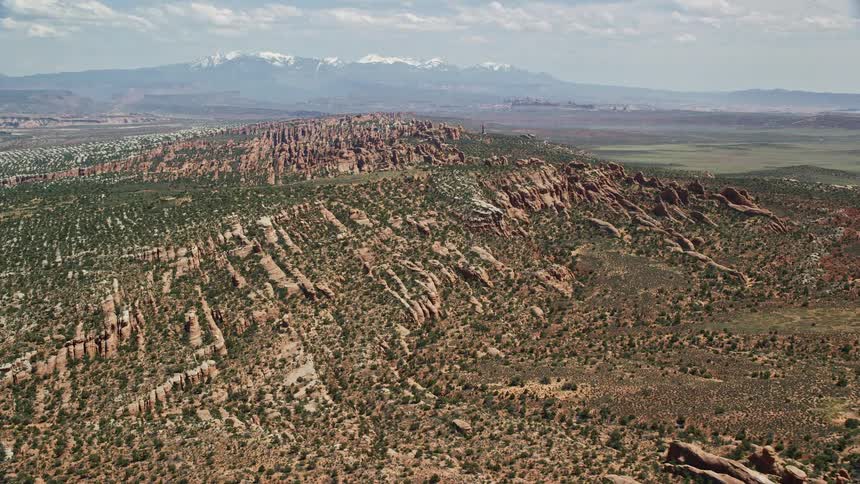 Aerial footage showcasing the stunning Devil's Garden rock fins at Arches National Park Utah during summertime