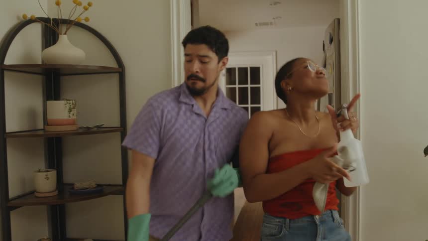 Friends dancing and doing house cleaning
