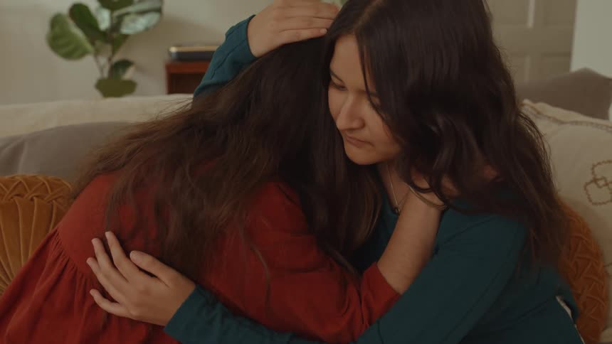 Friends hugging each other while crying