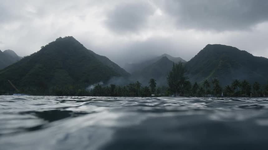 Exotic island with forest and mountains on a cloudy day