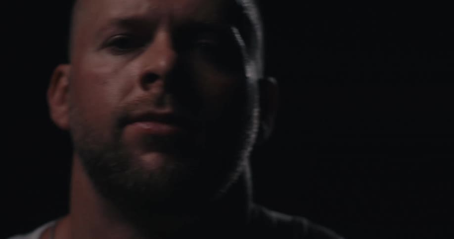 A man walks up in the dark