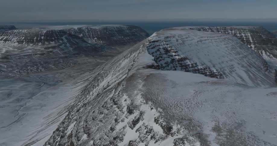 Snow covers plateaus and separating valley