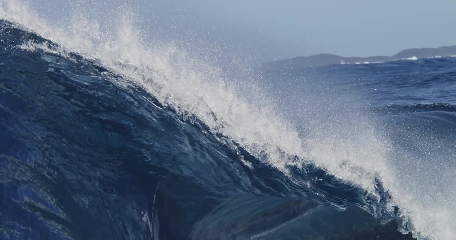 View of a moving wave forming a tube in the sea