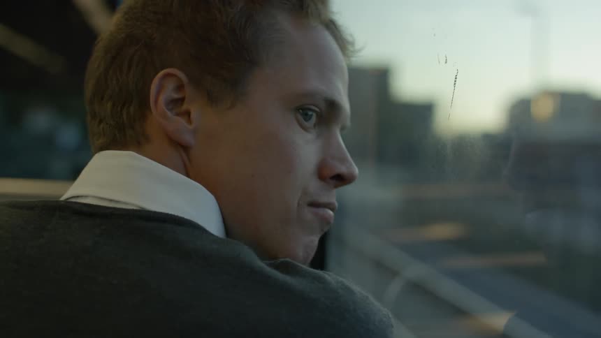 A man is riding a train