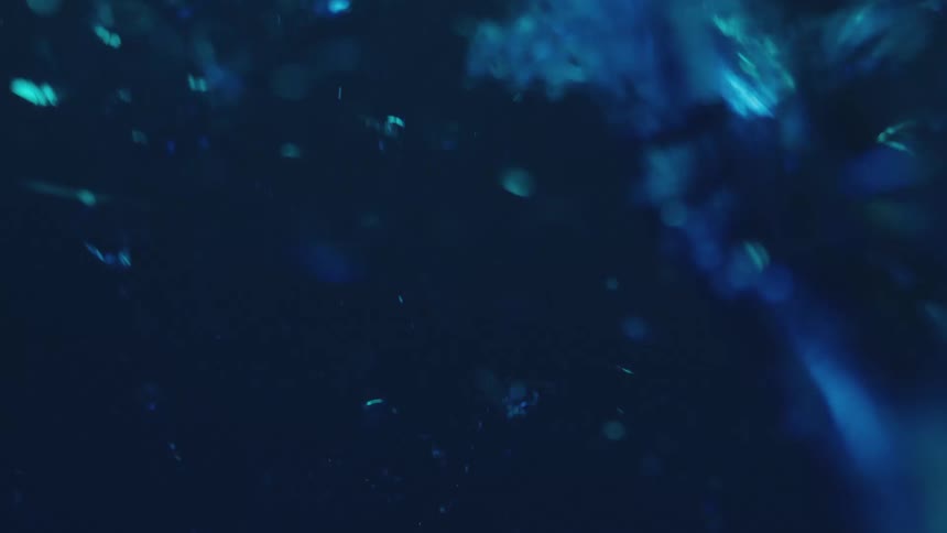 Glass breaking in a blue sea