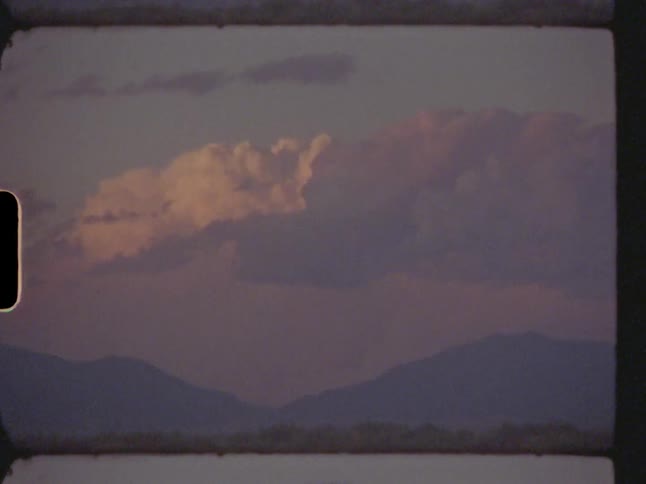 Clouds roll over mountains