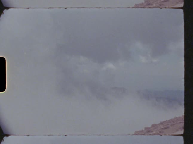 Clouds and fog roll over mountain