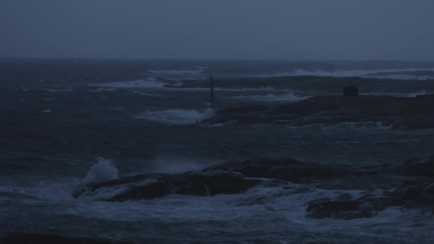 A coastal region where ocean waves break on rocks by the sea