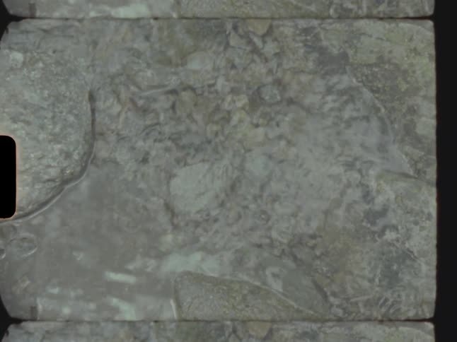 A small stream on a stone floor