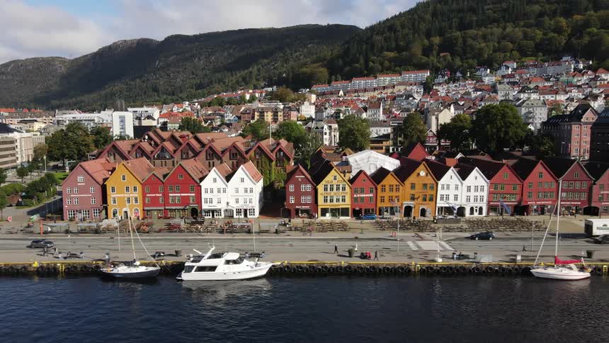 From an aerial view bryggen showcases a picturesque arrangement of historic wooden buildings lining the waterfront of bergen norway