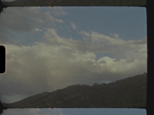 View of mountains with clouds passing in timelapse