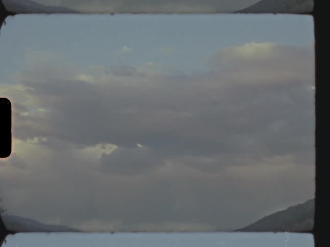 The clouds flow over the hills
