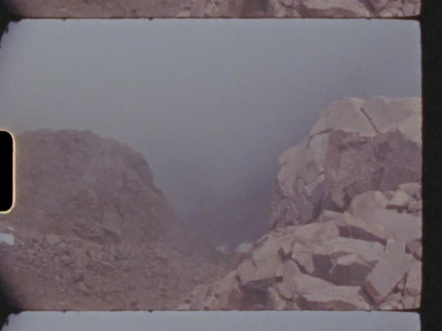Smoky haze over rocky terrain