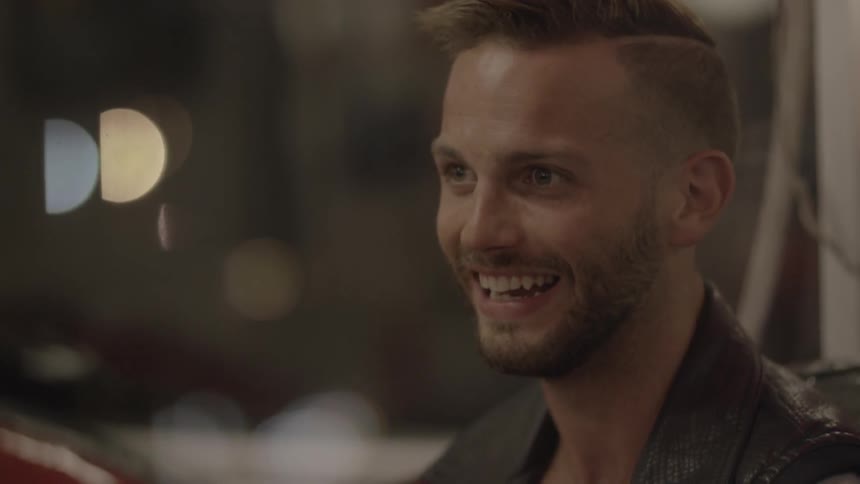 A man is talking and smiling
