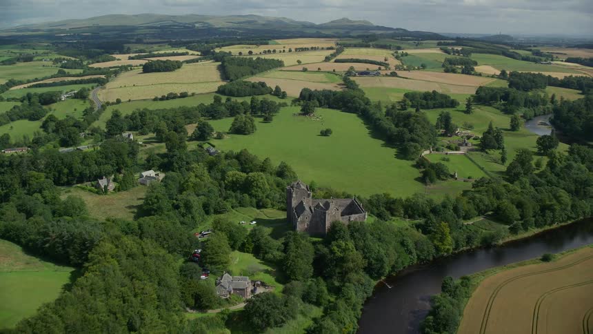 River winds through rural homes and green fields