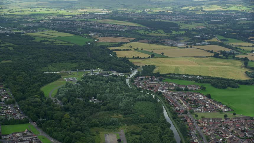 Aerial of a rural town with a small river and farmland