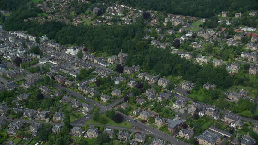 Homes sit along neat blocks in a dense neighborhood