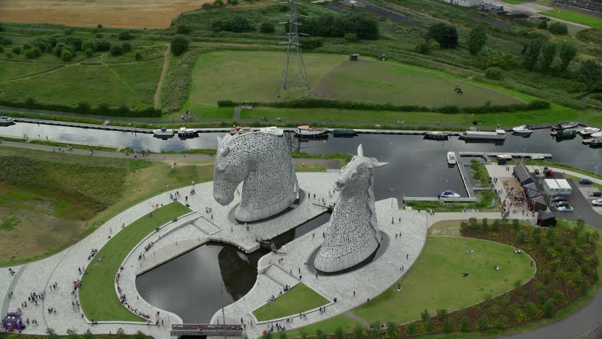 Aerial view of a public park with two horseshaped towers