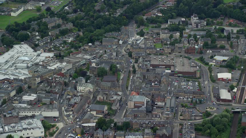 Homes and businesses sit close together in a dense neighborhood
