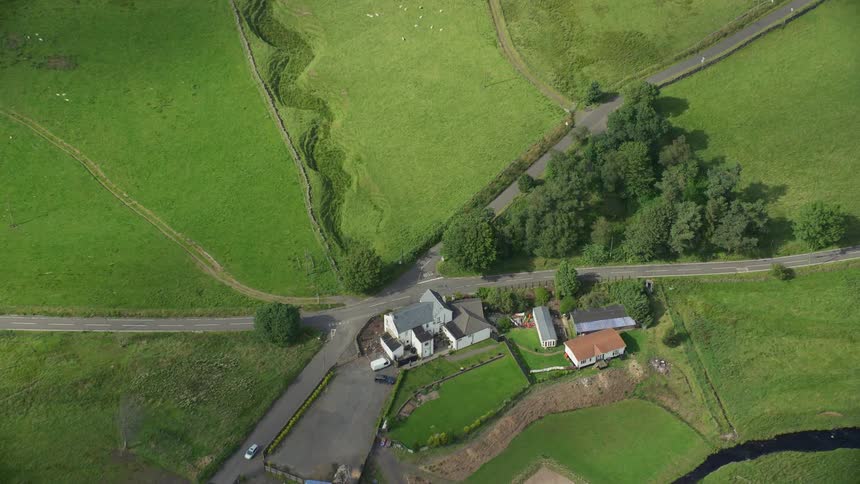 Aerial view of a small house in the countryside at morning