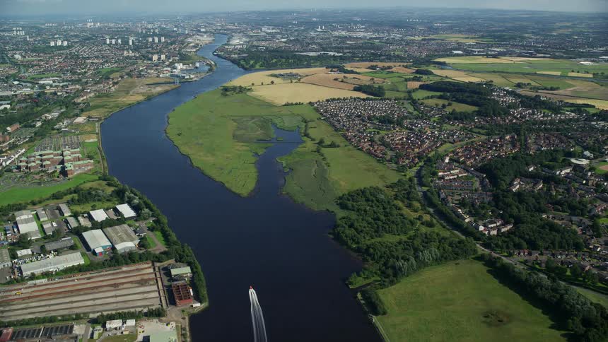 A huge river that crosses a city from the rural area to the urban area