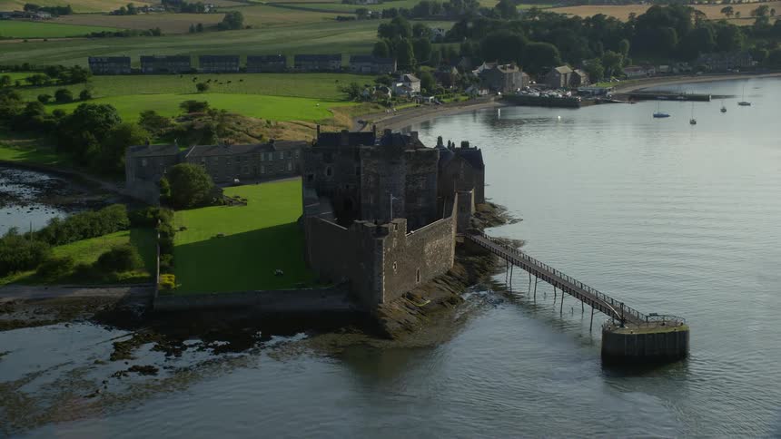 Aerial view of a historic monument by the edge of a lake