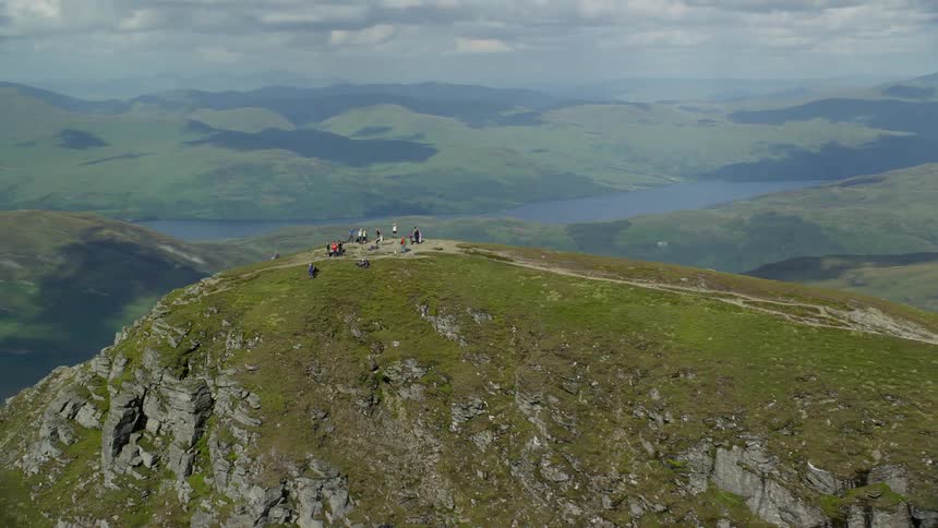 Some people on top of a mountain peak