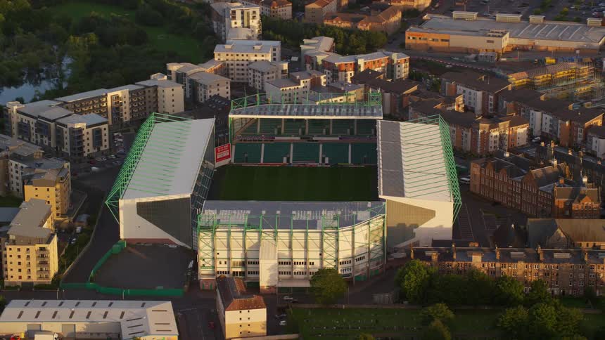 Aerial view of a large stadium in the middle of an urban city