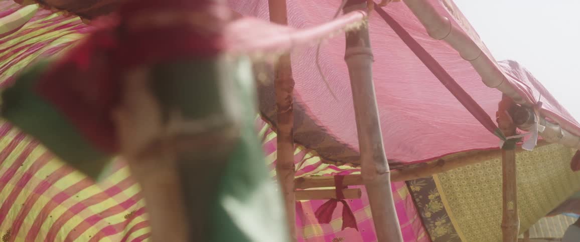 Wooden tents with colorful fabrics