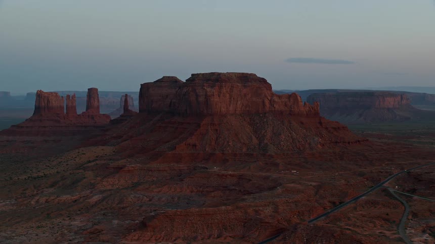Highways cross through foggy mesa terrain