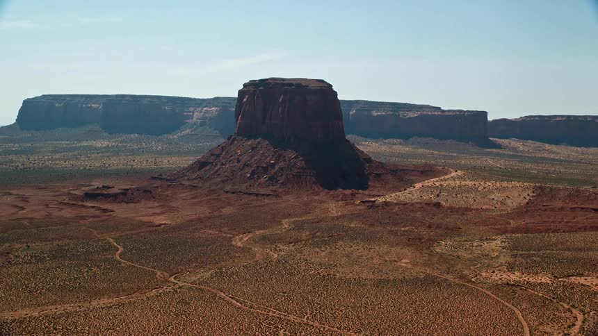 A large rock formation in a desert