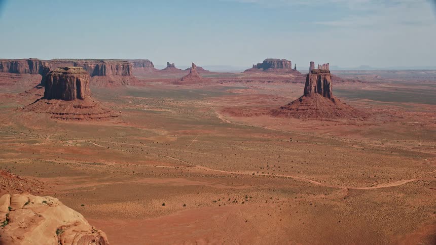 Aerial view of desert plateau with hills and a rocky terrain
