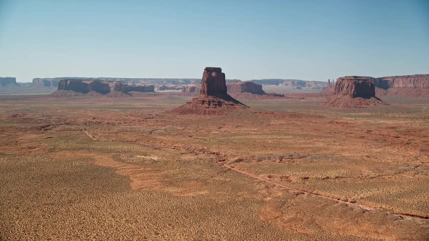 Aerial view of desert plateau with hills and a rocky terrain