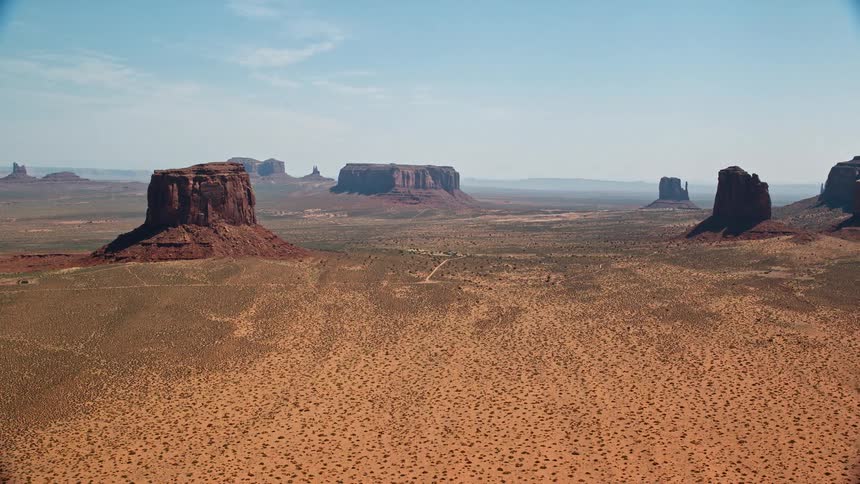 Aerial view of a natural environment with a valley cliffs and geological formations